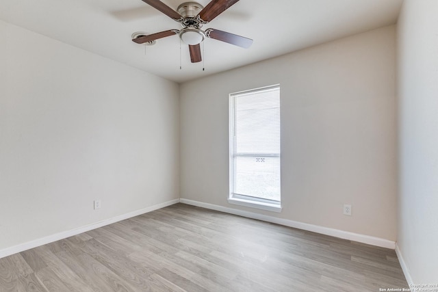 empty room featuring ceiling fan and light hardwood / wood-style flooring