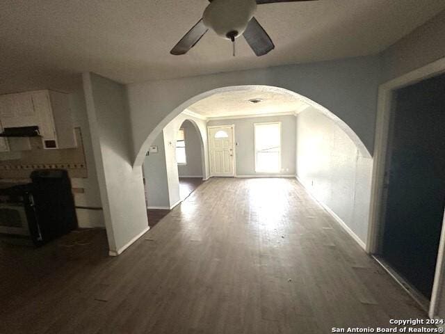 hall featuring dark hardwood / wood-style flooring and a textured ceiling