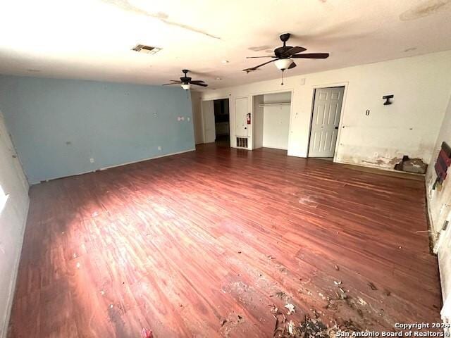 unfurnished living room featuring dark hardwood / wood-style floors