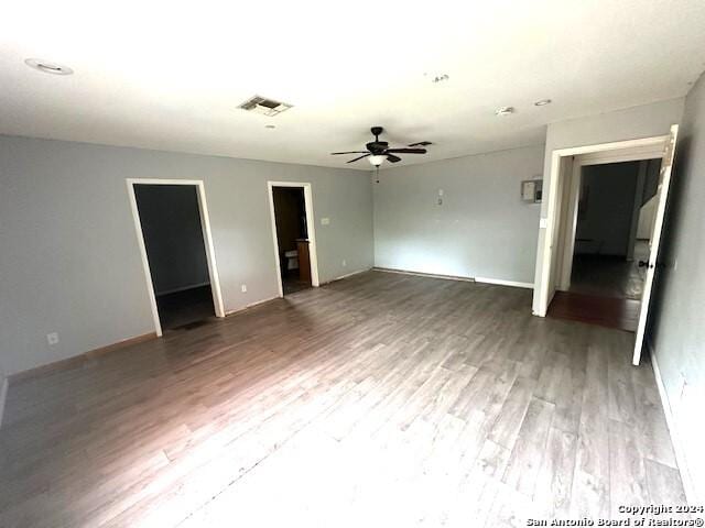 unfurnished room featuring hardwood / wood-style floors and ceiling fan