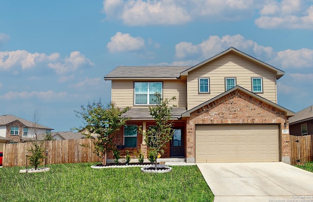 view of front of home with a garage and a front yard