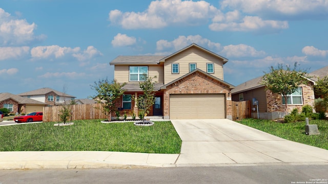 view of property with a front yard and a garage