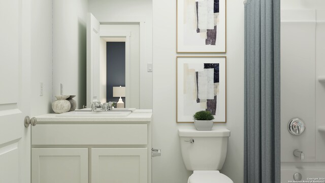 bathroom featuring vanity and toilet