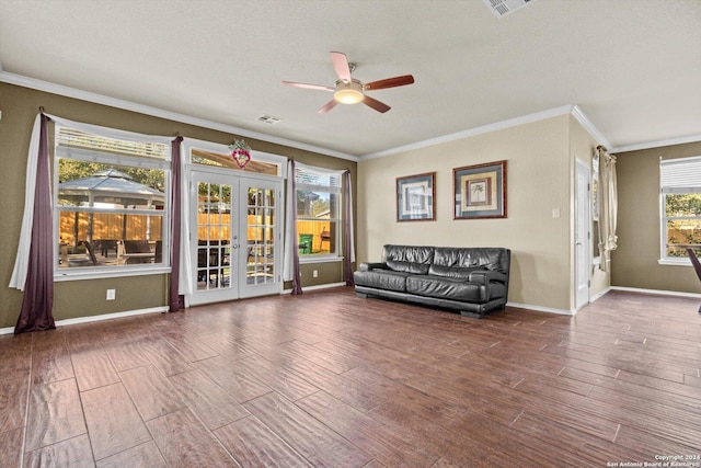 unfurnished room featuring french doors, ornamental molding, and hardwood / wood-style floors