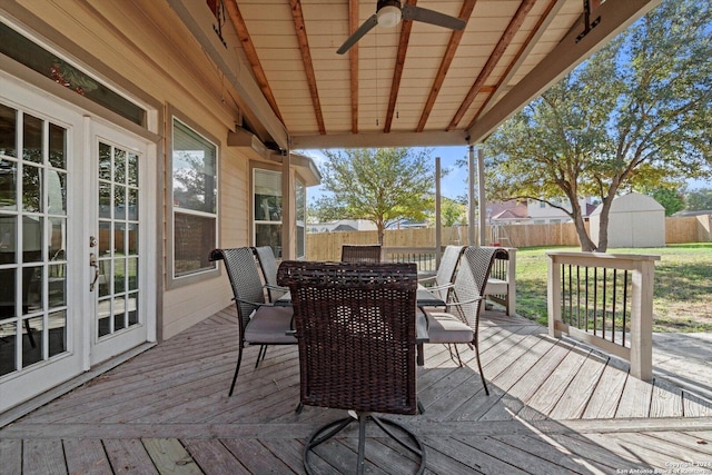 wooden deck featuring ceiling fan and french doors