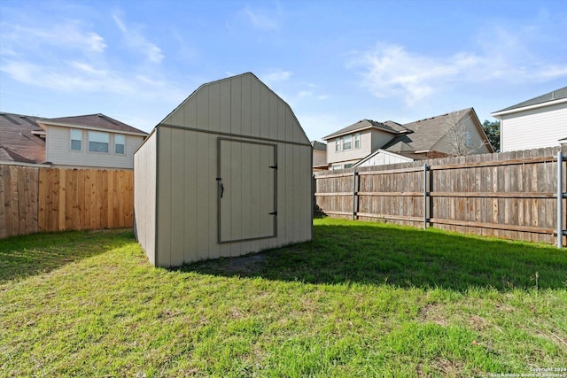 view of outbuilding featuring a yard