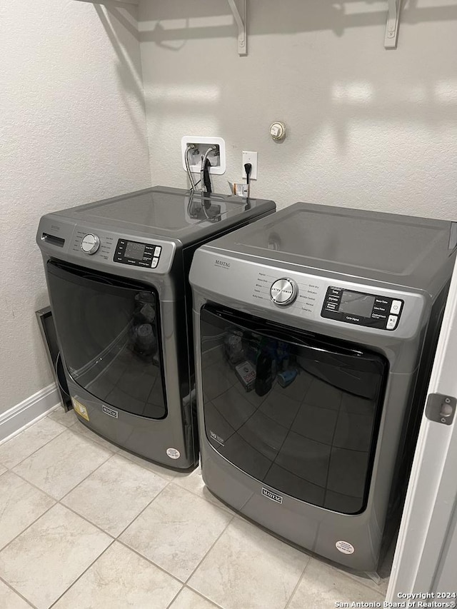 12142 Casparis, San Antonio, TX 78254 - laundry area with washer and dryer and light tile patterned flooring