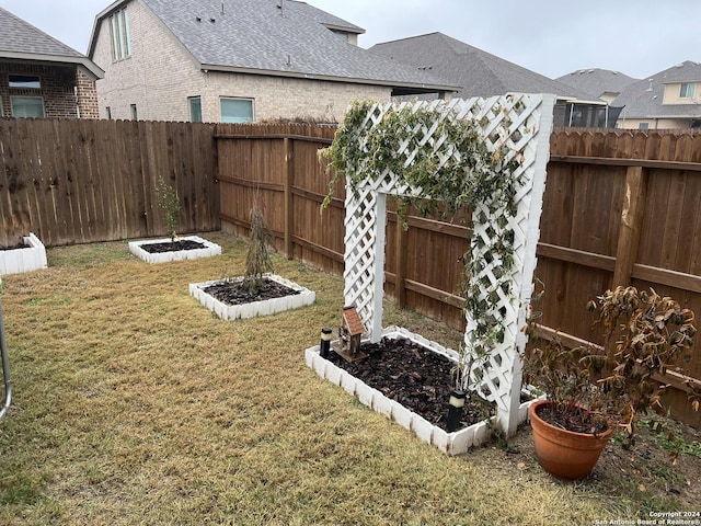 12142 Casparis, San Antonio, TX 78254 - view of yard featuring a garden