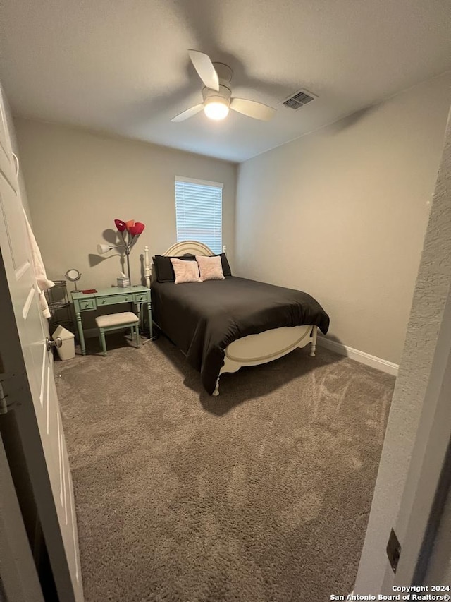 bedroom featuring ceiling fan and carpet floors