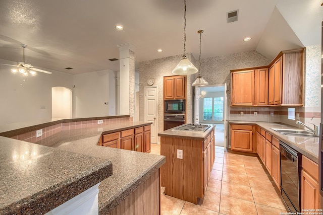 kitchen featuring black appliances, sink, vaulted ceiling, ceiling fan, and a kitchen island