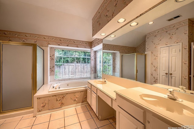 bathroom featuring separate shower and tub, tile patterned flooring, vanity, and vaulted ceiling