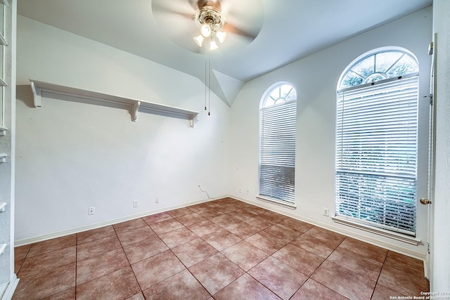 unfurnished room featuring tile patterned floors and ceiling fan