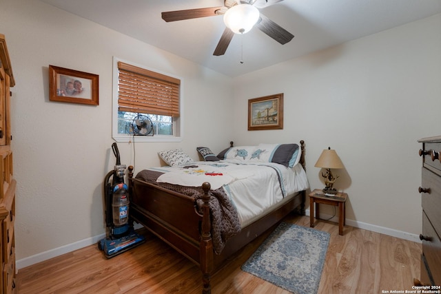 bedroom with light hardwood / wood-style floors and ceiling fan