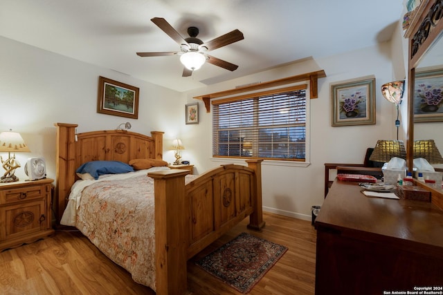 bedroom featuring hardwood / wood-style floors and ceiling fan