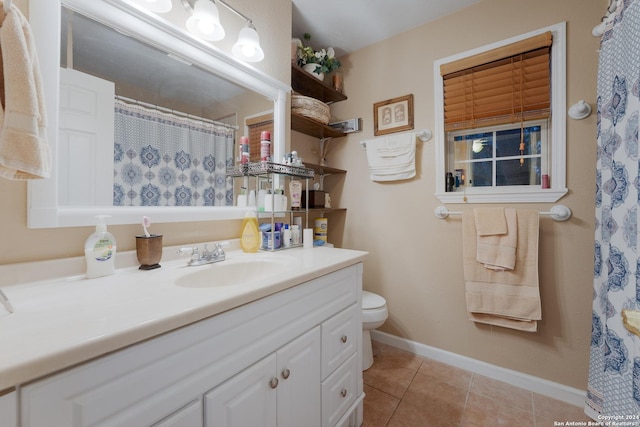 bathroom with tile patterned floors, vanity, and toilet