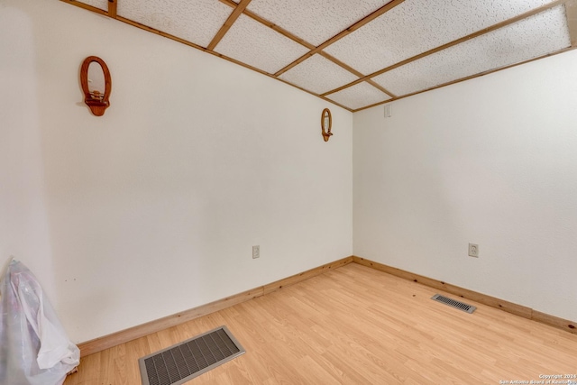 spare room with wood-type flooring