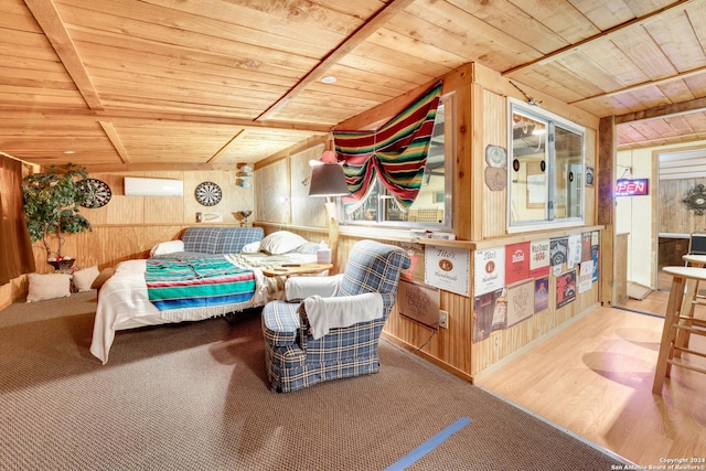 bedroom with hardwood / wood-style floors, lofted ceiling, wooden walls, a wall mounted AC, and wood ceiling