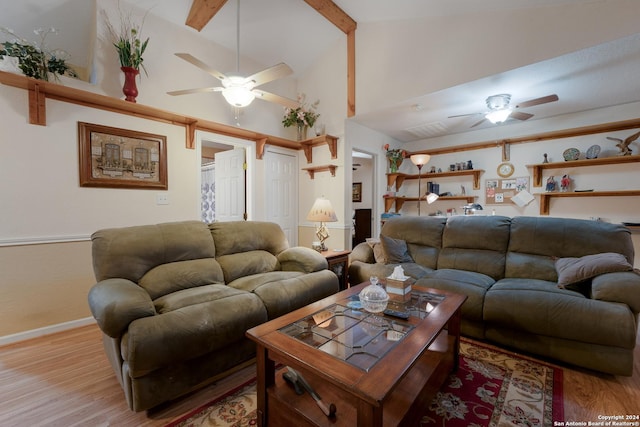 living room featuring beam ceiling, high vaulted ceiling, and light hardwood / wood-style flooring