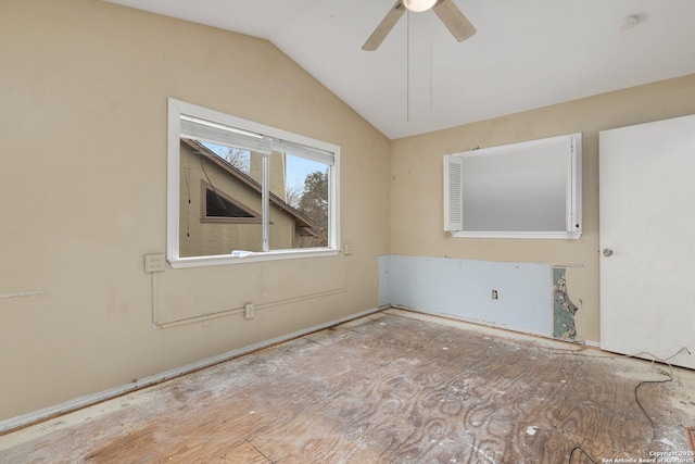 spare room featuring ceiling fan and vaulted ceiling