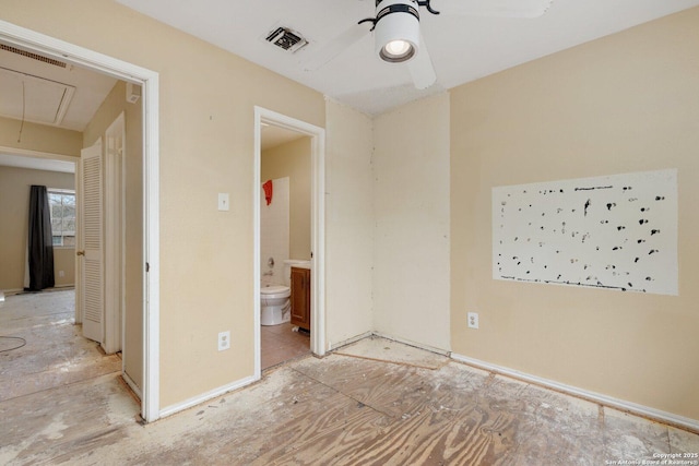 unfurnished bedroom with ensuite bathroom and ceiling fan