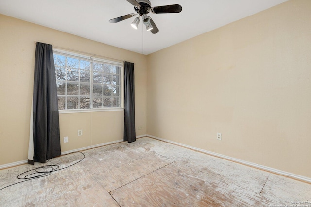 spare room with ceiling fan