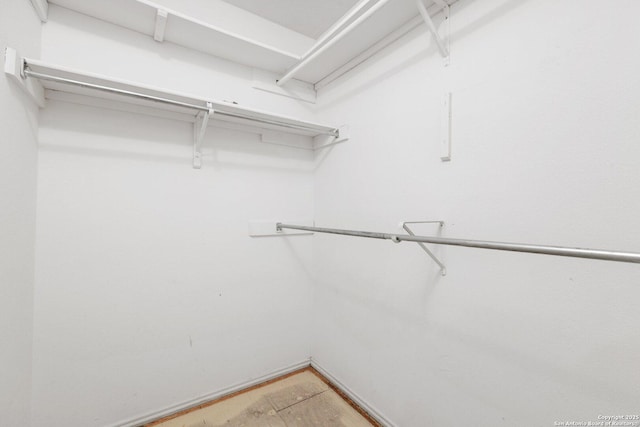 walk in closet featuring hardwood / wood-style floors