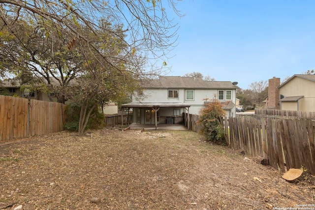 back of property featuring a patio