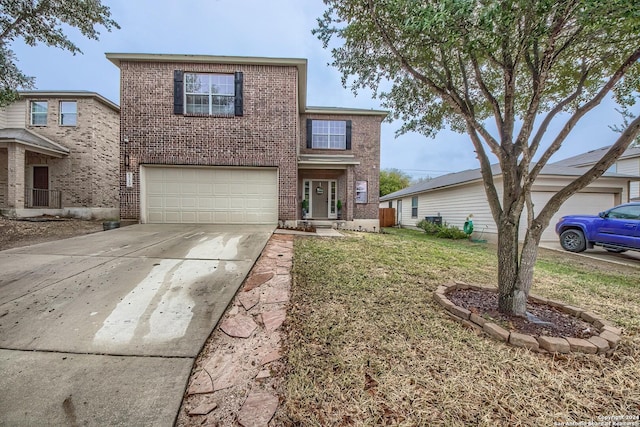 view of front of property featuring a front yard and a garage