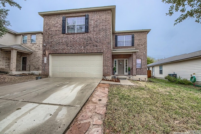 view of front property featuring a garage and a front lawn