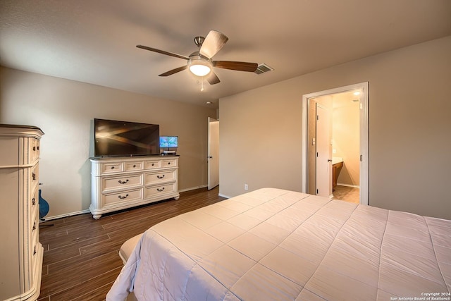 bedroom featuring ceiling fan, ensuite bathroom, and dark hardwood / wood-style floors