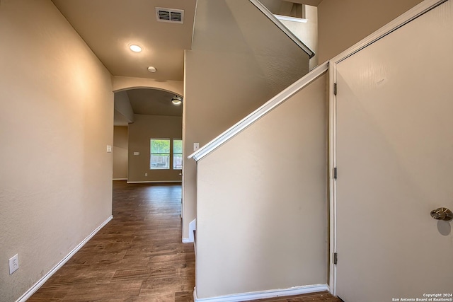 hallway with dark hardwood / wood-style floors