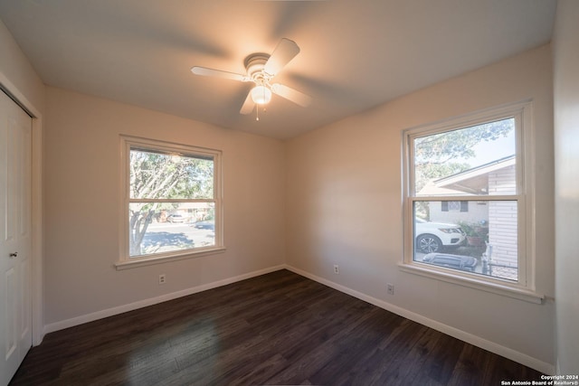 interior space featuring ceiling fan, dark wood-type flooring, and a closet