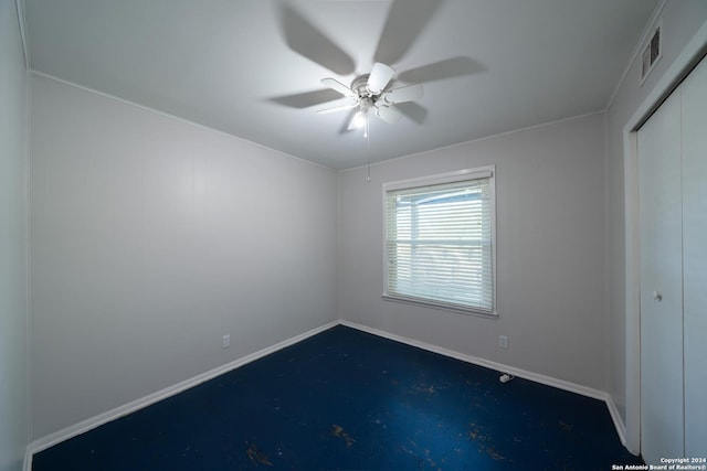 unfurnished room with ceiling fan