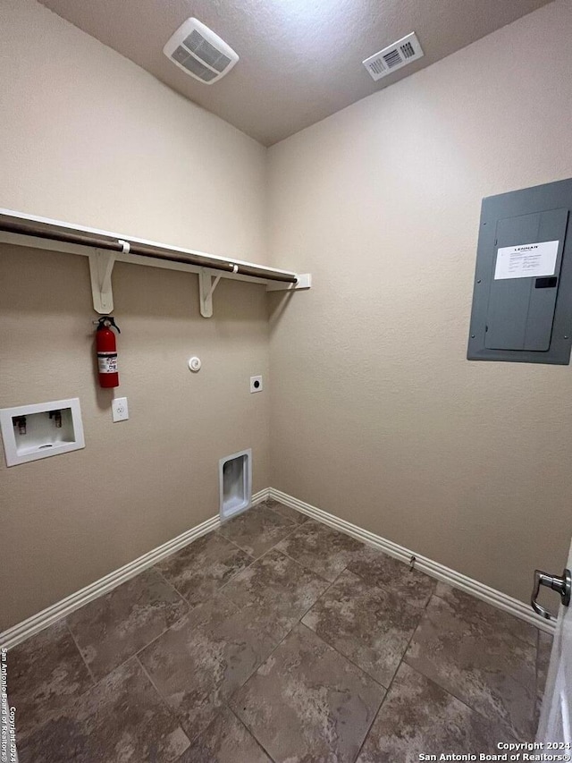 washroom featuring electric panel, hookup for a gas dryer, hookup for a washing machine, and hookup for an electric dryer