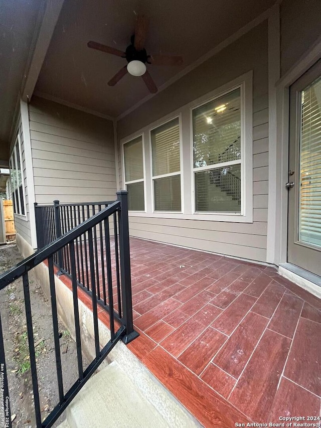 exterior space with ceiling fan