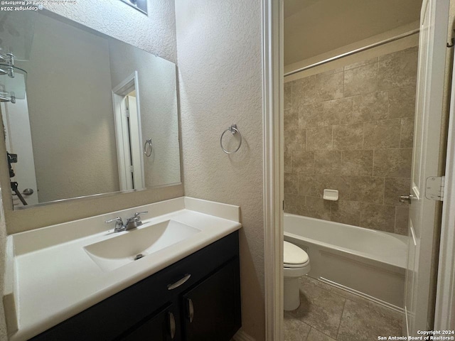 full bathroom with vanity, toilet, and tiled shower / bath