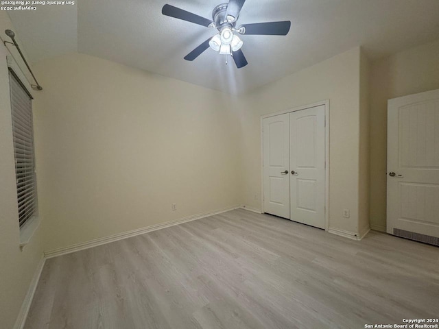 unfurnished bedroom featuring a closet, ceiling fan, and light hardwood / wood-style floors