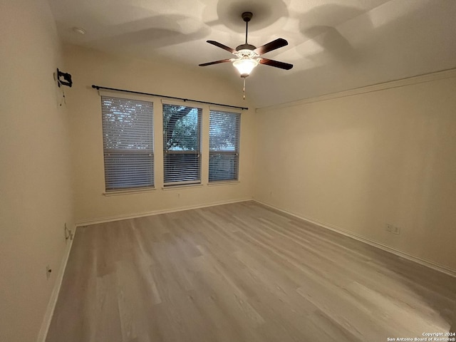 empty room featuring ceiling fan and light wood-type flooring