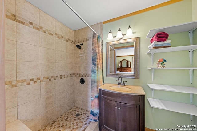 bathroom with a shower with curtain and vanity