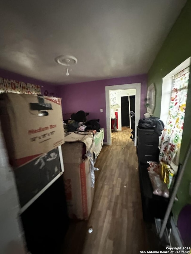 bedroom with hardwood / wood-style flooring