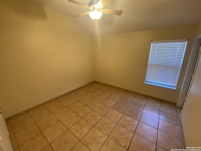 unfurnished room with light tile patterned floors and ceiling fan