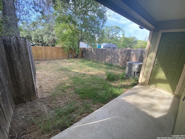 view of yard with central AC