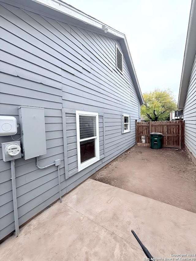 view of property exterior with a patio