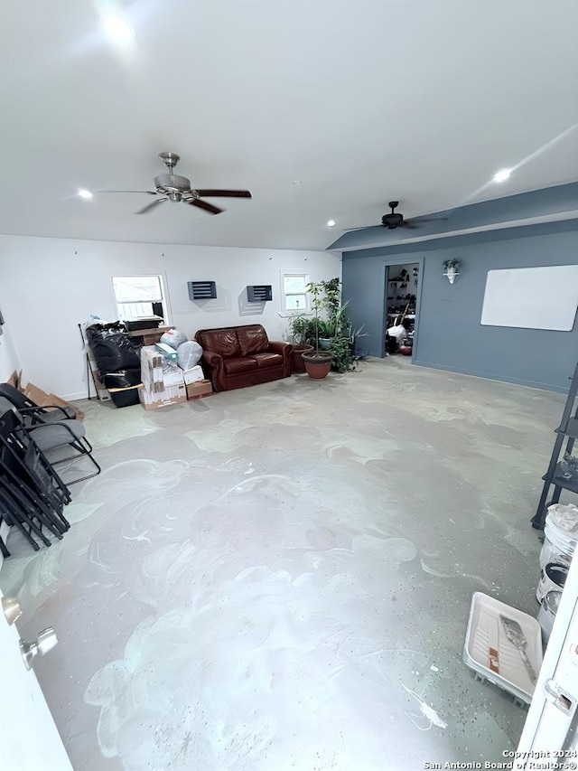 unfurnished living room featuring concrete flooring, ceiling fan, and a healthy amount of sunlight