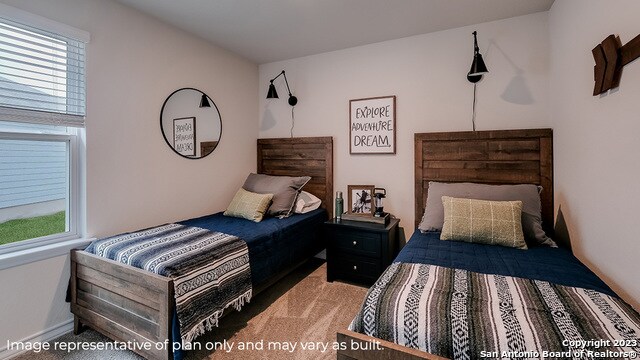 bedroom featuring light colored carpet