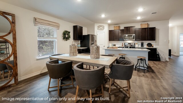 dining area with dark wood-type flooring