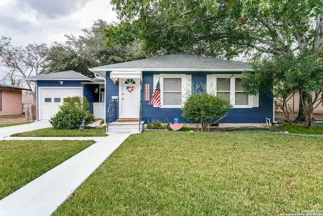 single story home featuring a garage and a front yard