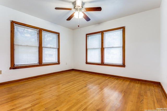 spare room with ceiling fan and light hardwood / wood-style floors