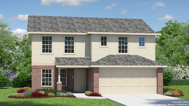 view of front facade featuring a front yard and a garage