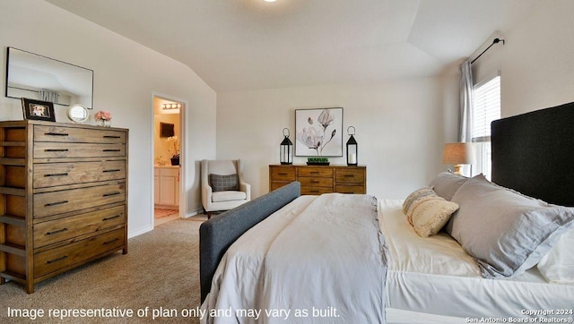 bedroom with connected bathroom, light carpet, and vaulted ceiling